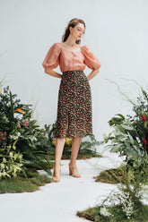 Silk puff-sleeve blouse with square neckline and front buttons for an elegant silhouette